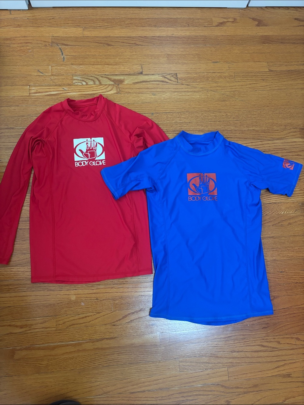 Body Glove blue and red rash guard tops